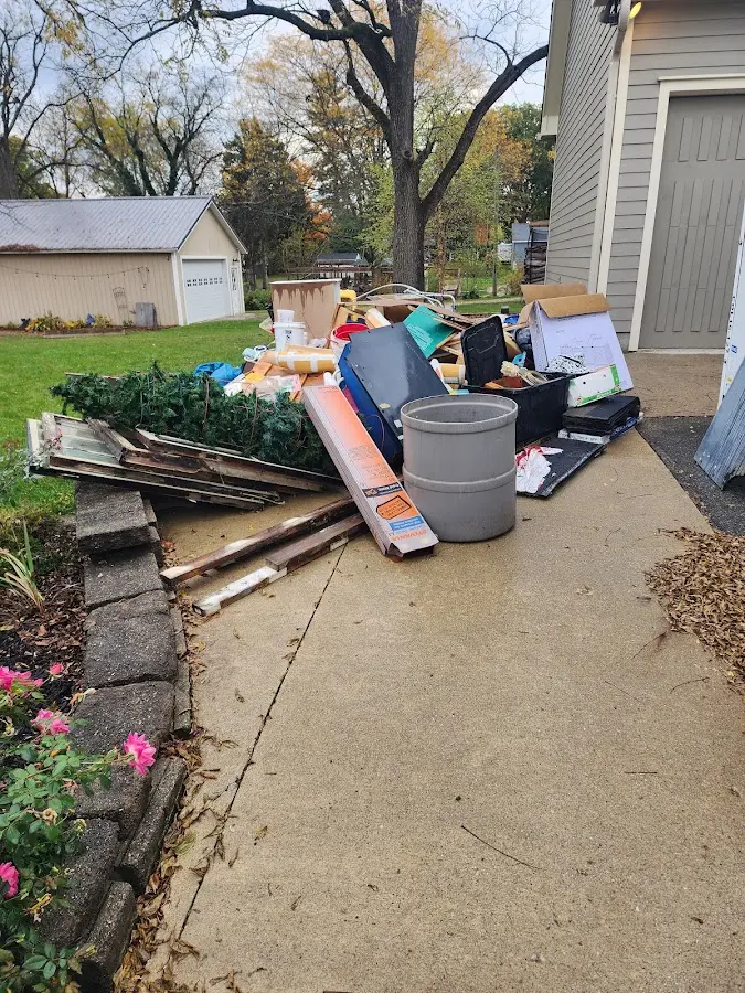 Dumpster being loaded with debris for Residential Dumpster Rental in Columbus